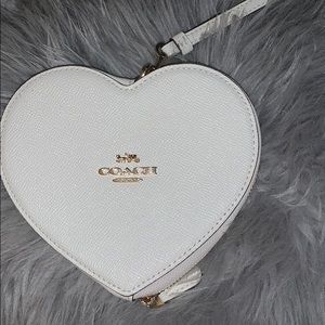 Heart shaped coach wristlet.